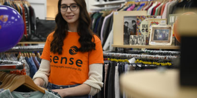 Woman in Sense shop smiling at camera