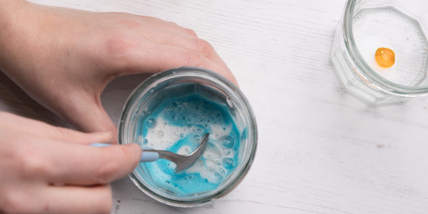 Carefully mix together with the spoon until the colours are fully blended with the foam.