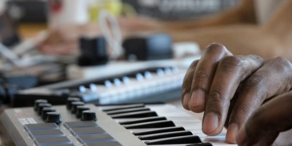 A pair of hands are playing the keyboard.