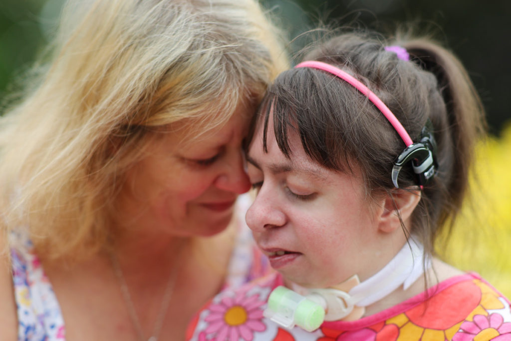 Nicola Slator and her daughter Rebecca Slator, 20, who is deaf, autistic and wears a tracheostomy.