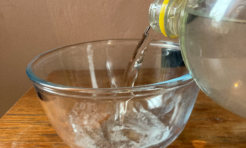 Image shows fizzy pop being poured into the bowl.