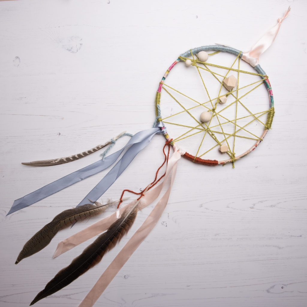 You can make your own feathers or beads from repurposed plastic bottles  Why not make an eco-friendly dream catcher using only recycled items or things found in nature? Try different sized hoops to make a selection of dream catchers – you could even go huge with a hula hoop! 