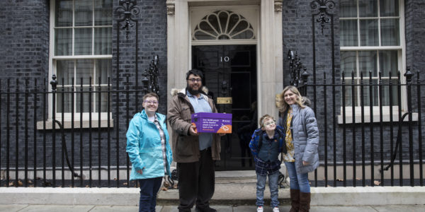 A group of people handing in a petition at 10 Downing Street