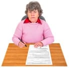 woman unhappy at a desk with a form