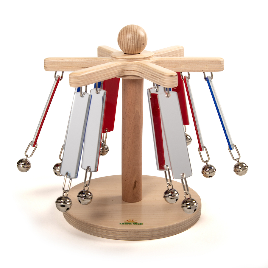 A spinning wooden carousel toy with mirrors and bells.