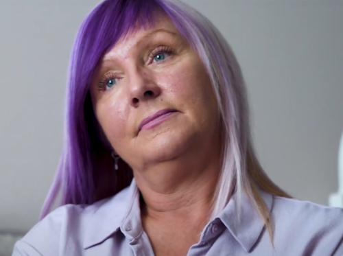 A close-up of Yvette, a white woman with blonde and purple hair.
