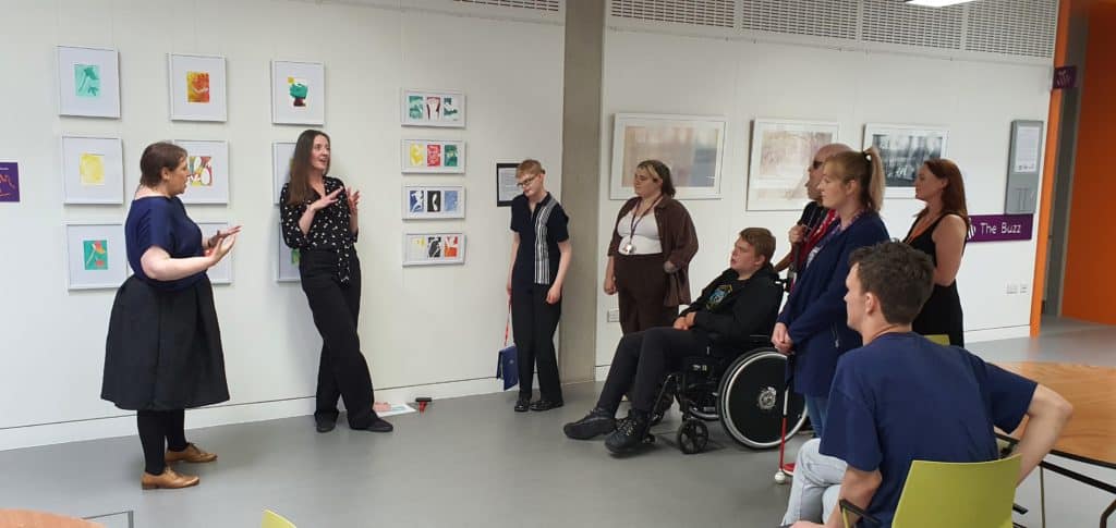 Artists describing their work to the visitors