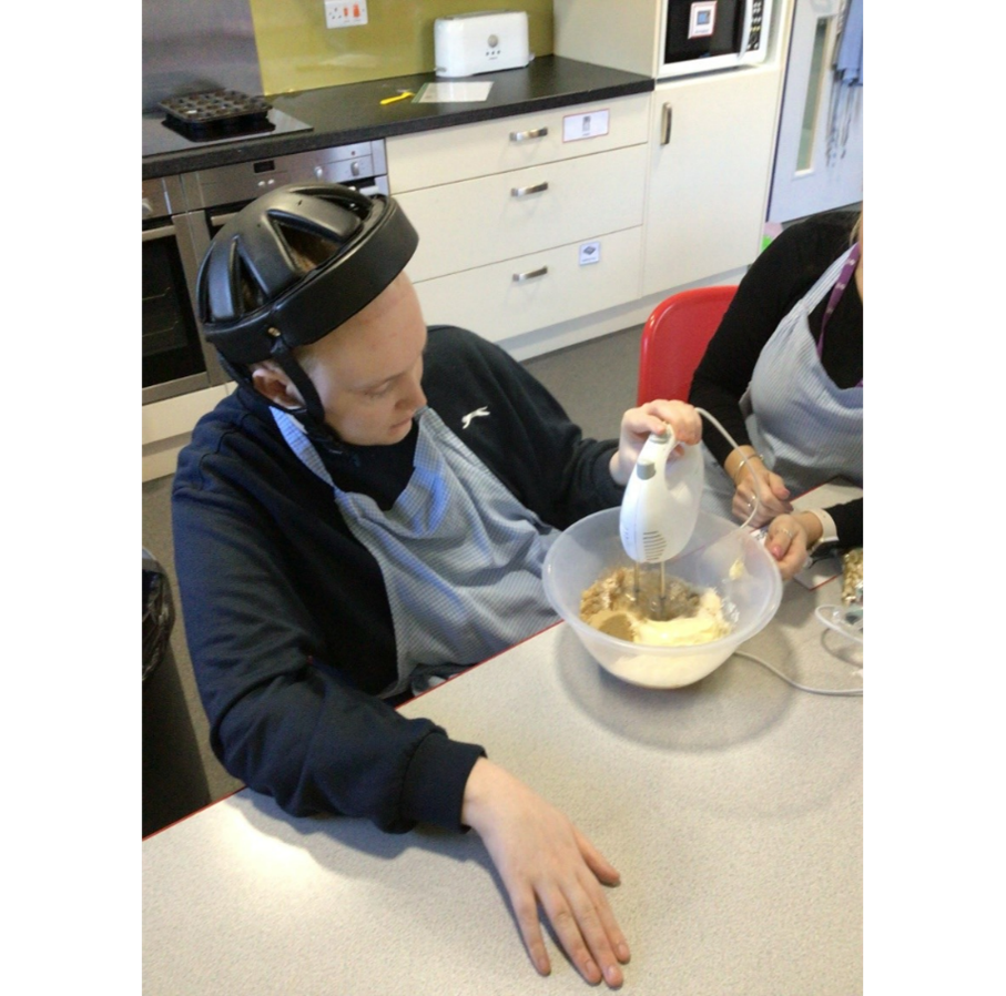 Luke using the electric whisk independently. 