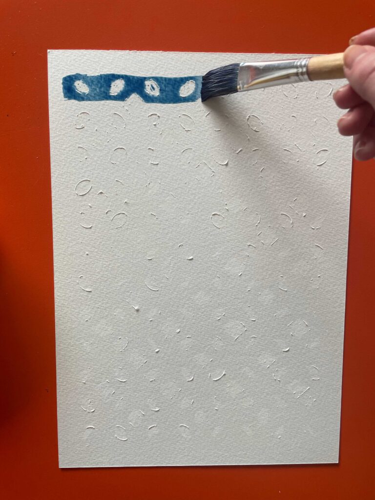 Painting with a brush to see the pattern appear
