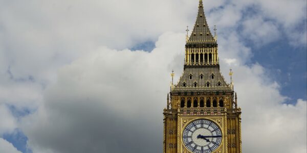 Top of Elizabeth Tower (nicknamed Big Ben) at Westmister in front of a cloudy sky