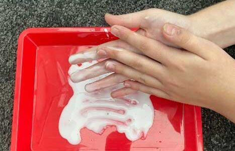 Getting hands into a tray of glue