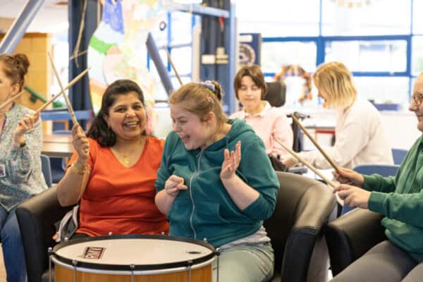 A group of people drumming
