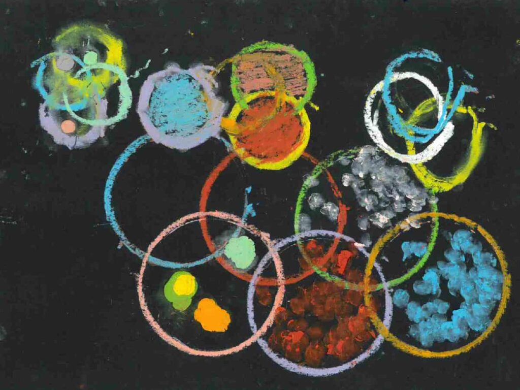 A series of layered circles in different sizes and styles on a black background