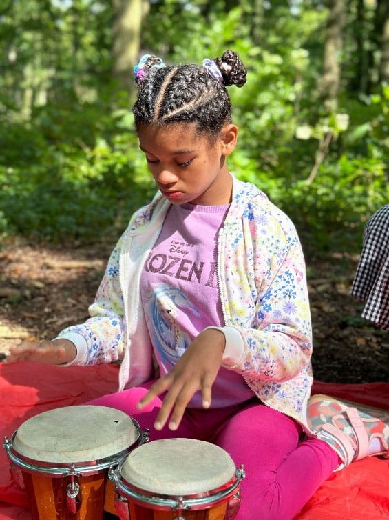 Elisia plays the drums on a Sense Holiday