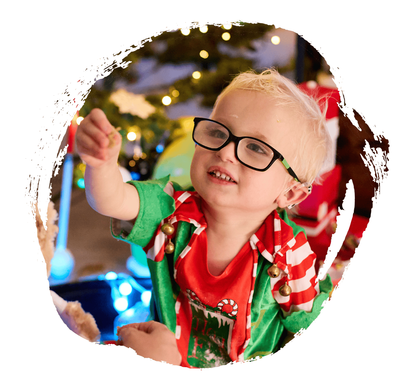 Harvey wearing a Christmas tshirt and black glasses.