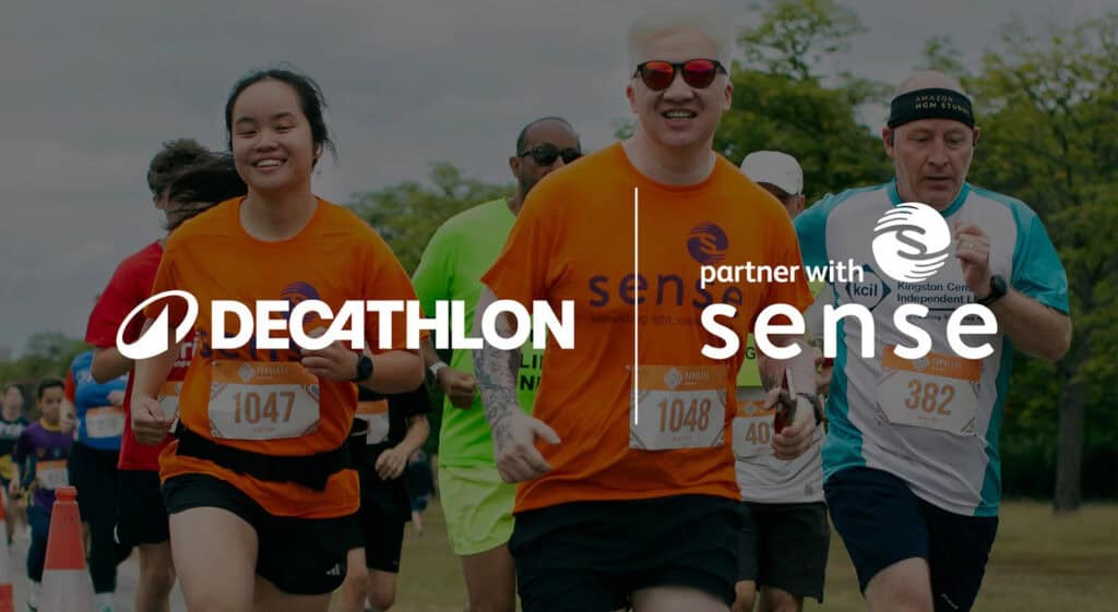 People running in a race wearing Sense branded T shirts. There are the declathlon and Sense logos.